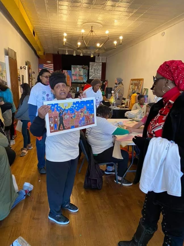 Community members participating in a YES Center arts workshop